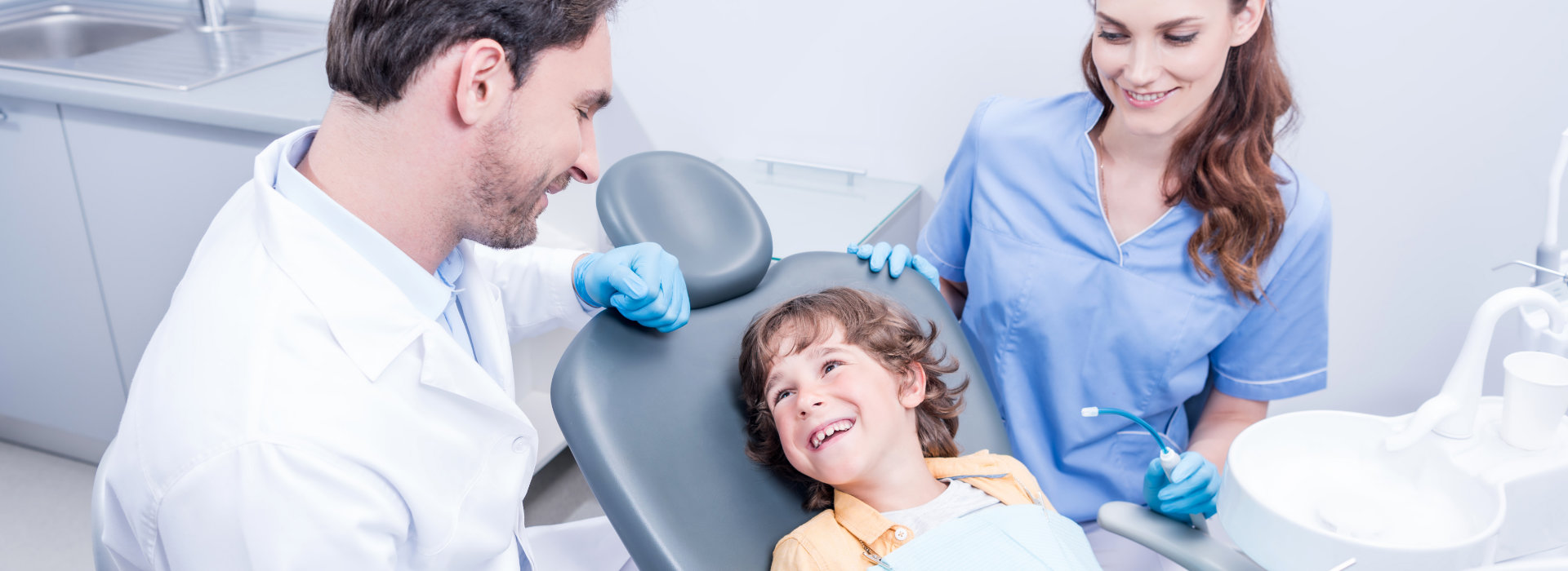 A kid is smiling after pediatric dentistry.